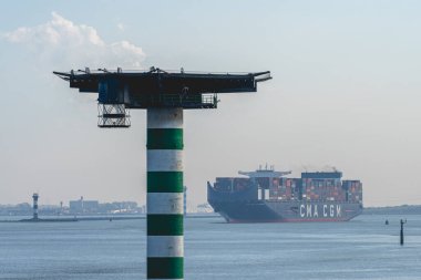 October 25, 2024. Maasvlakte Rotterdam, The Netherlands. A huge Cargo Ship leaving the Harbour of Rotterdam. clipart