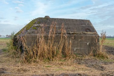 Historic bunkers in the countryside in Utrecht. Schalkwijk, The Netherlands. clipart