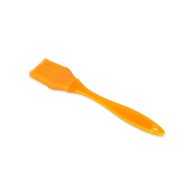 Orange silicon kitchen brush isolated over white background.