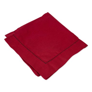 Folded wine red tissue napkin isolated over white background.