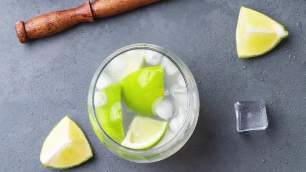 Brazilian Lemon Caipirinha Glasses Ice Fruit Slices Stone Background — Stok video
