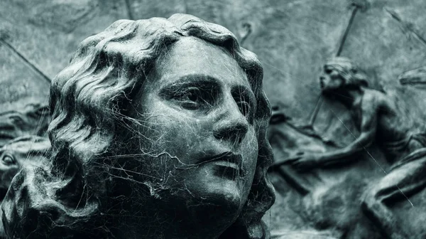 stock image Close view of the face of a woman bronze statue covered with spider webs. Taken in Recoleta cemetery