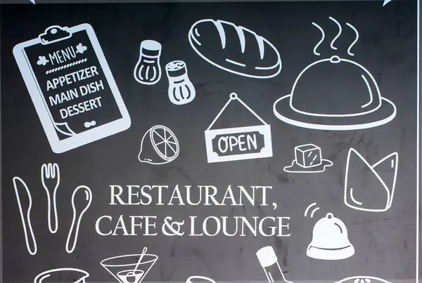 stock image Hand drawn fast food symbol on chalkboard in front of restaurant.