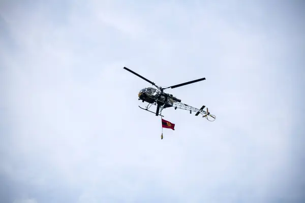 stock image Kolkata, India 12th December 2023 : Indian air force helicopter is flying on isolated blue sky