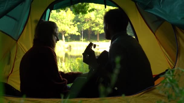 Side View Young Couple Sitting Camping Tent Playing Guitar — Stock Video