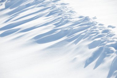 Abstract shadow and light patterns in snow