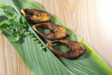 Fried Ilsha on Turmeric leaf. Hilsa fry is popular in pohela boishakh festival among Bengali's in India and Bangladesh. Ilish. Tenualosa ilish clipart