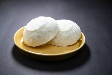 Steamed Rice Cake or Bhapa Pitha is a traditional dish of Bangladesh. Winter Vapa Pitha snacks on plate. clipart
