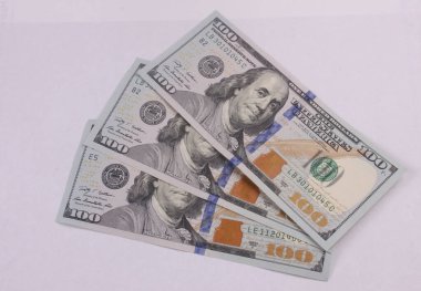 scrolled stack of dollar bills