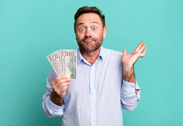 Middle Age Man Feeling Puzzled Confused Doubting Dollar Banknotes Concept — Stockfoto