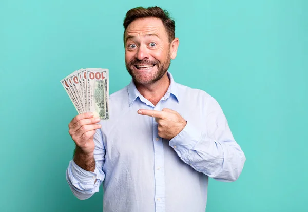 Middle Age Man Looking Excited Surprised Pointing Side Dollar Banknotes — Stockfoto