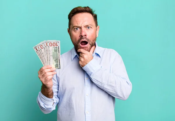 Middle Age Man Mouth Eyes Wide Open Hand Chin Dollar — Stockfoto