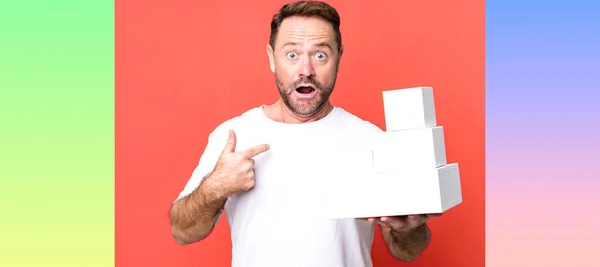 Middle Age Man Feeling Happy Pointing Self Excited Blank Packages — Stock Photo, Image