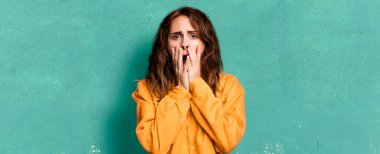 hispanic pretty woman feeling shocked and scared. guilt concept