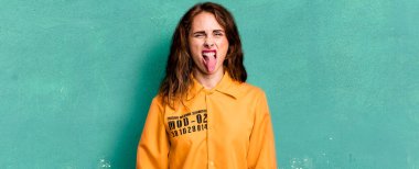 hispanic pretty woman feeling disgusted and irritated and tongue out. guilt concept