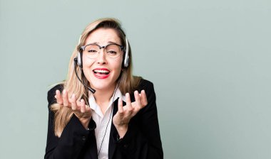 looking desperate, frustrated and stressed. telemarketer concept