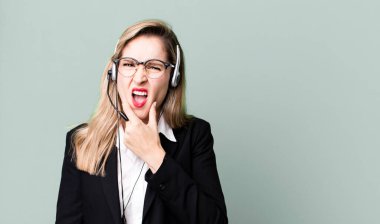 with mouth and eyes wide open and hand on chin. telemarketer concept