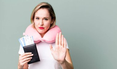 looking serious showing open palm making stop gesture. flight passenger concept