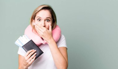covering mouth with hands with a shocked. flight passenger concept
