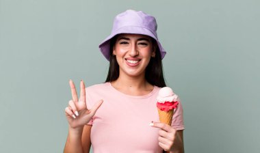 smiling and looking friendly, showing number three. ice cream and summer concept