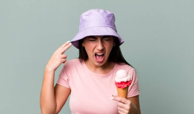 looking unhappy and stressed, suicide gesture making gun sign. ice cream and summer concept