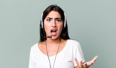 looking angry, annoyed and frustrated. telemarketer concept