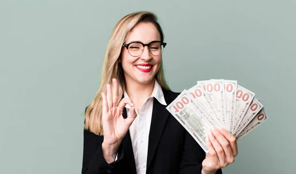 pretty blonde woman  with dollar banknotes