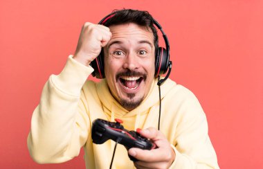 adult man gamer with headset and a control concept