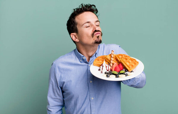 adult man having waffles for breakfast