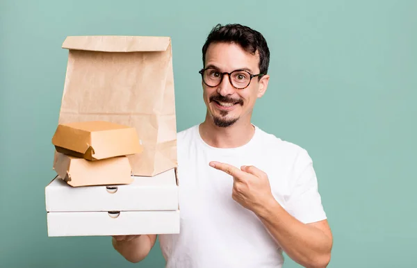 Adult Man Smiling Cheerfully Feeling Happy Pointing Side Fast Food — Fotografia de Stock