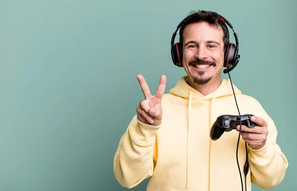 Adult Man Smiling Looking Happy Gesturing Victory Peace Headset Control — Stockfoto