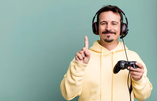Adult Man Smiling Looking Friendly Showing Number One Headset Control — Stock Photo, Image