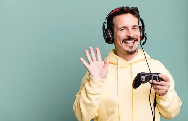Adult Man Smiling Happily Waving Hand Welcoming Greeting You Headset — Stock Photo, Image