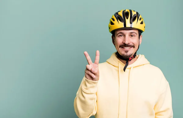 Adult Man Smiling Looking Friendly Showing Number Two Bike Helmet – stockfoto