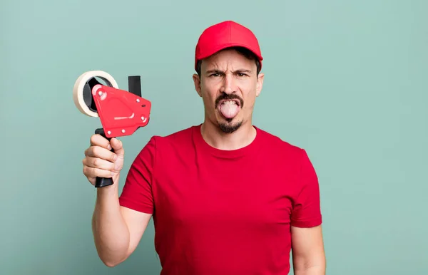 Adult Man Feeling Disgusted Irritated Tongue Out Deliveryman Packer Concept — Stockfoto