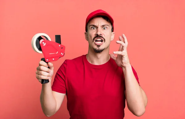 Adult Man Screaming Hands Air Deliveryman Packer Concept — Stockfoto