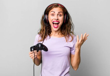 hispanic pretty woman feeling happy, surprised realizing a solution or idea. gamer concept