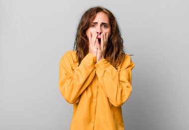 hispanic pretty woman feeling shocked and scared. guilt concept