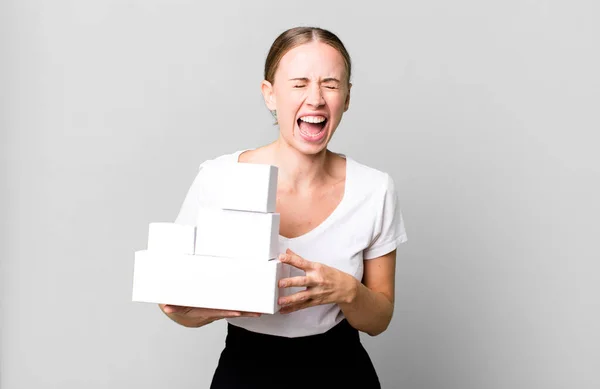 Caucasian Pretty Woman Shouting Aggressively Looking Very Angry White Boxes — Stockfoto