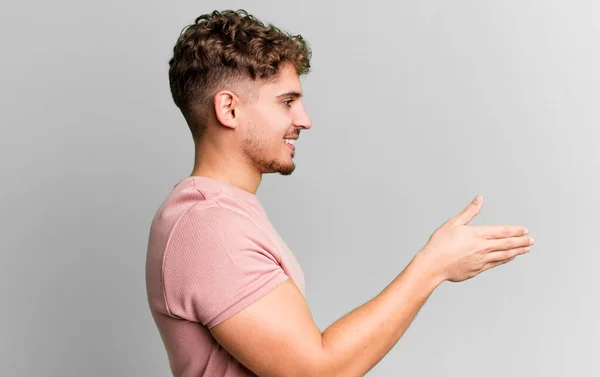 Young Adult Caucasian Man Smiling Greeting You Offering Hand Shake — Foto de Stock