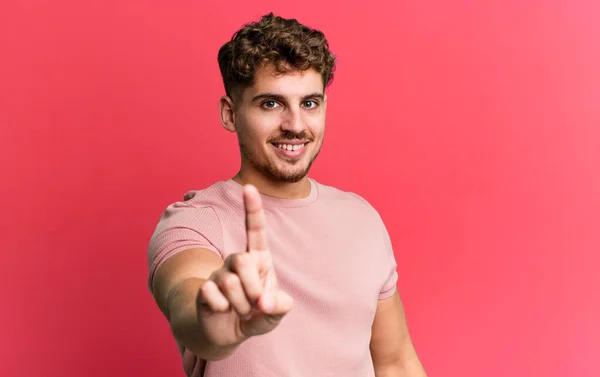 Young Adult Caucasian Man Smiling Proudly Confidently Making Number One — Photo