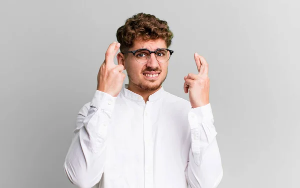 Young Adult Caucasian Man Crossing Fingers Anxiously Hoping Good Luck — Foto Stock
