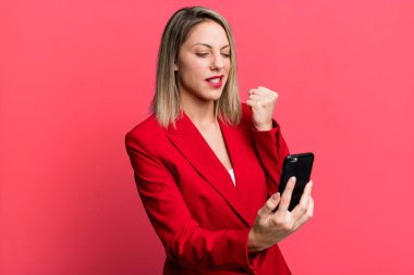 young pretty businesswoman using her smart phone