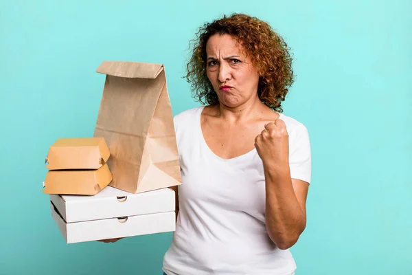 feeling angry, annoyed, rebellious and aggressive. take away fast food delivery concept.