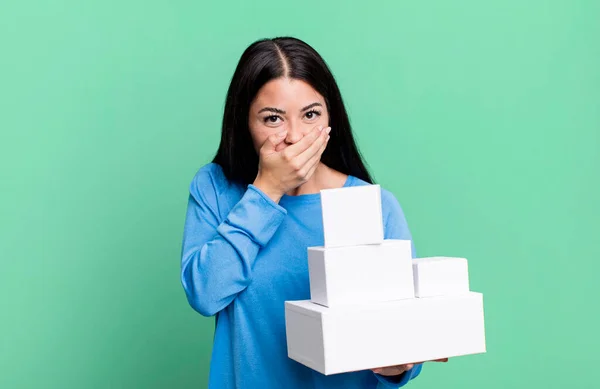Hispanic Pretty Woman Covering Mouth Hands Shocked White Boxes Packagings — Foto Stock