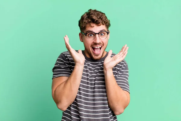 Young Adult Caucasian Man Feeling Shocked Excited Laughing Amazed Happy — Stockfoto
