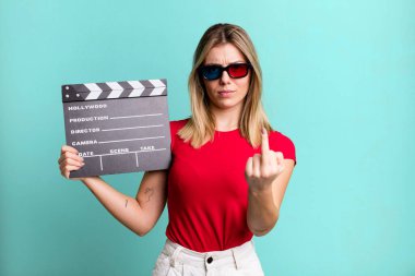 young pretty woman feeling angry, annoyed, rebellious and aggressive. film, cinema and movie concept