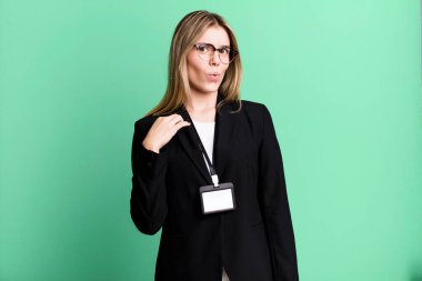 young pretty woman feeling stressed, anxious, tired and frustrated. id card accreditation concept