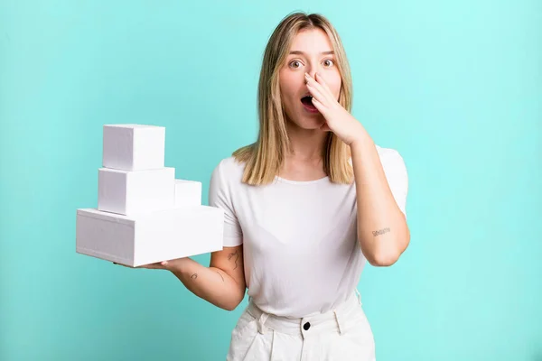 Young Pretty Woman Covering Mouth Hands Shocked Blank White Boxes — Stock Photo, Image