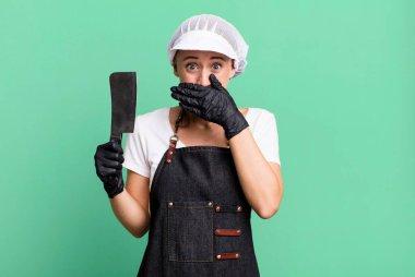 covering mouth with hands with a shocked. butcher concept